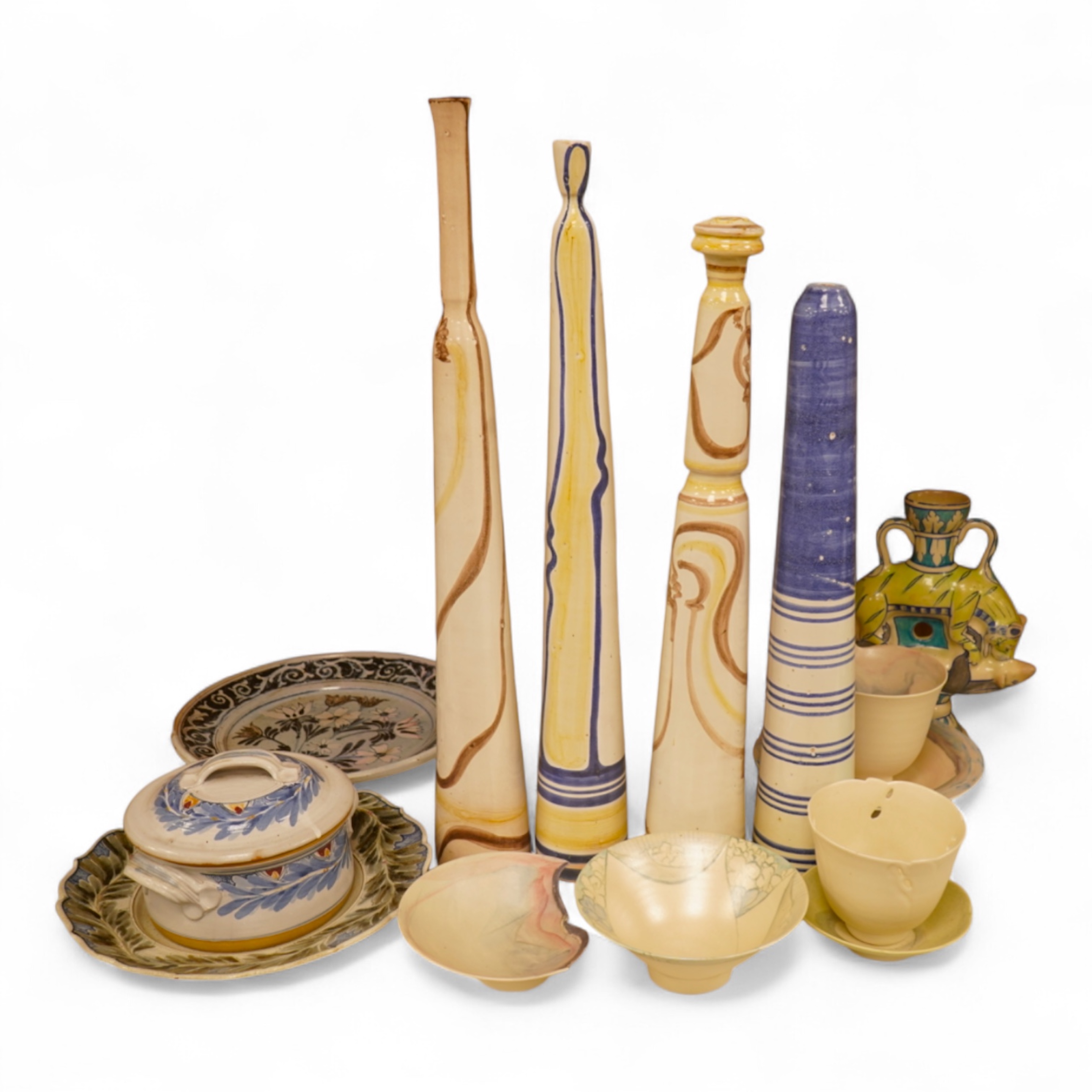 A mixed collection of European studio pottery to include a collection of four tall Italian candlesticks, tallest 58cm, two stoneware plates and a tureen and cover, etc.
